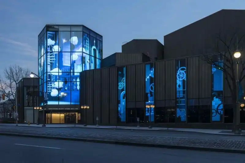 the LED walls shift tone—thank you messages, recap videos, sponsor spotlights